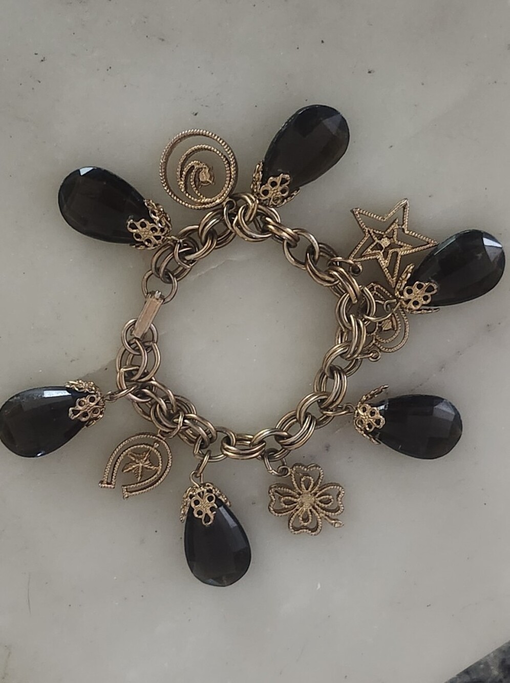 Stylish Gold-Tone Charm Bracelet with Black Teardrop Stones And Crystal Accents